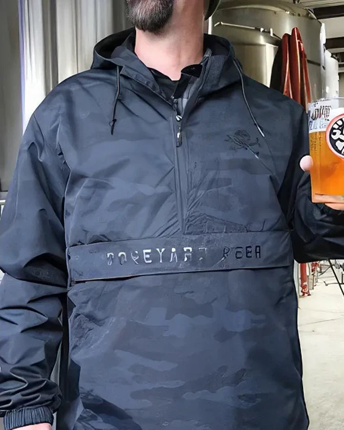 Boneyard beer black camo jacket being worn within the brew house.