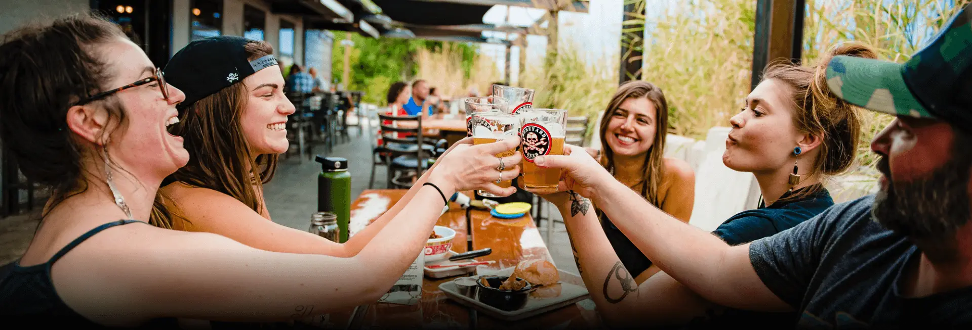 A group of patrons enjoying a beer on our patio.