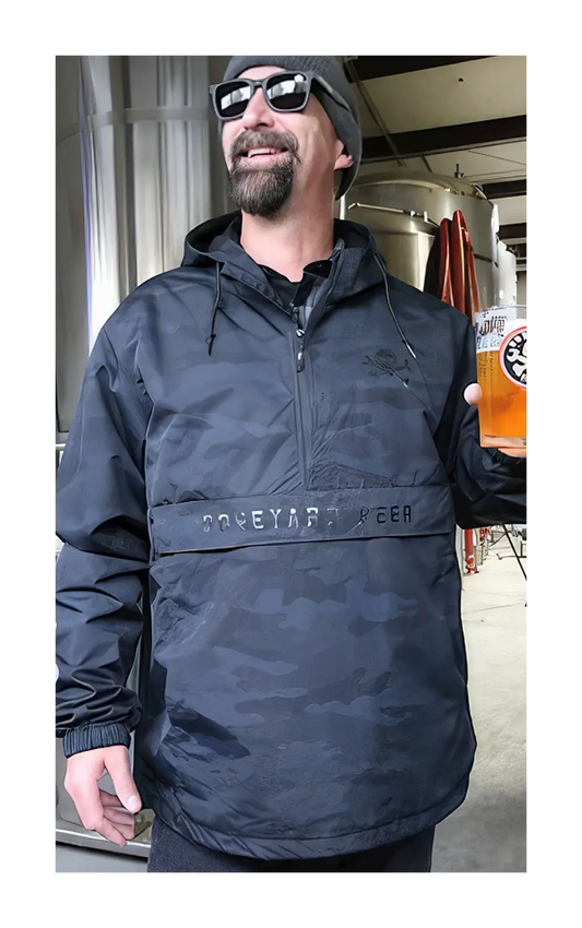 Boneyard beer black camo jacket being worn within the brew house.