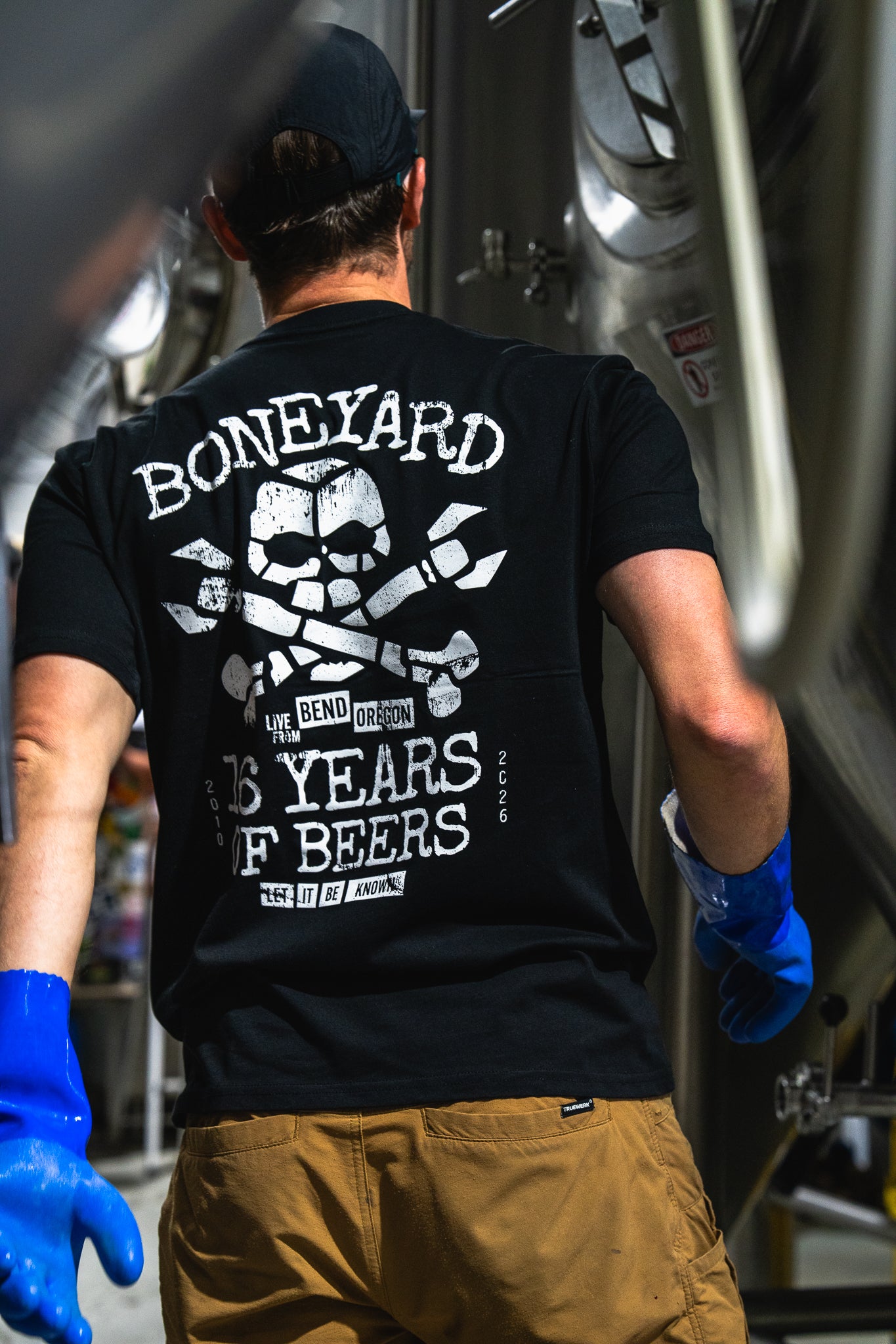 back of man wearing Boneyard 16 years of beers shirt