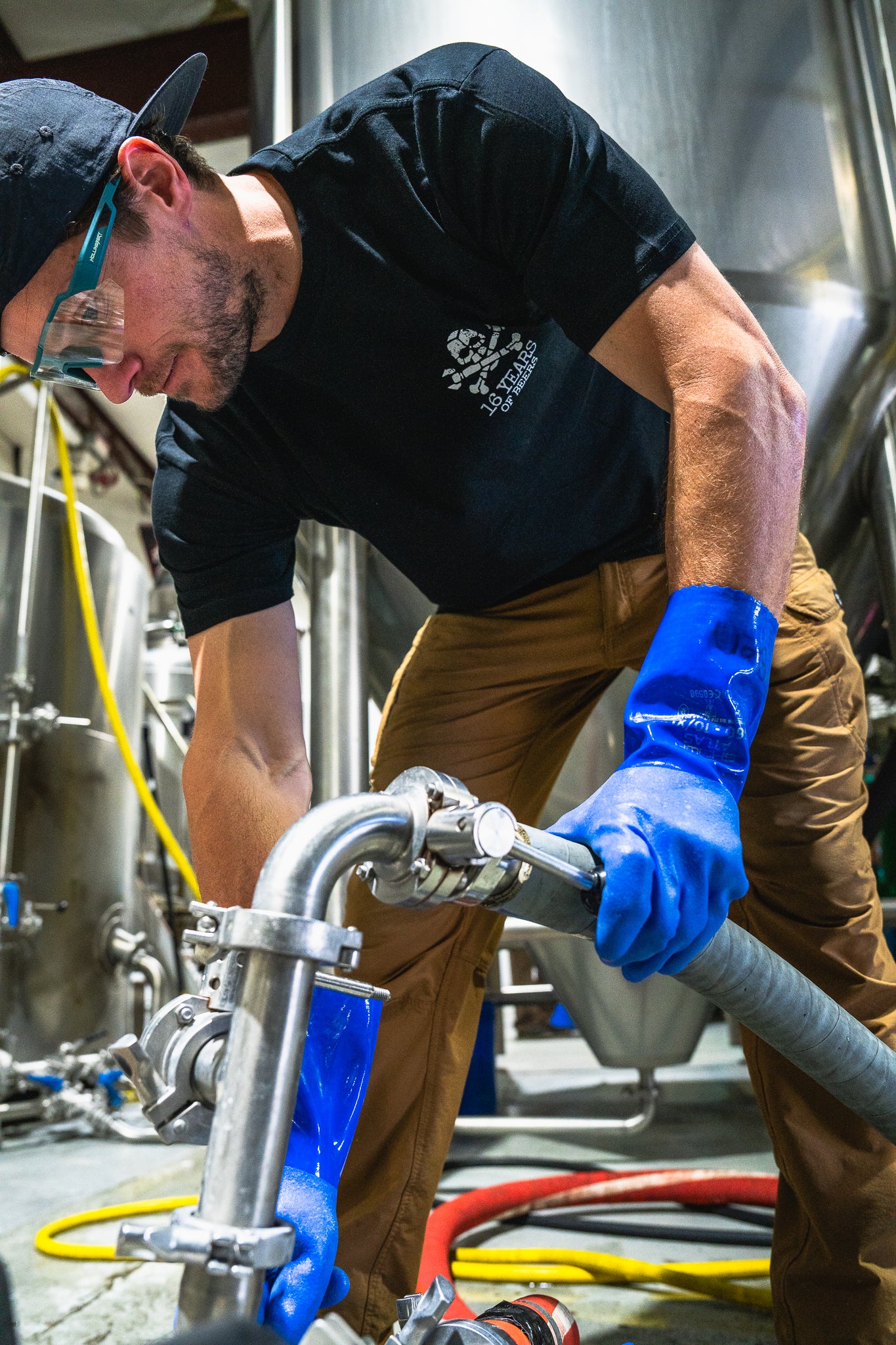 man wearing 16 years of beer shirt with skull and cross bones