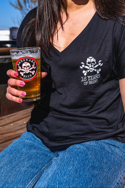 Front of 16 years of beers v neck with boneyard skull and cross bones