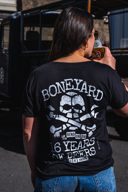 girl wearing 16 years of beers v neck from behind with boneyard logo