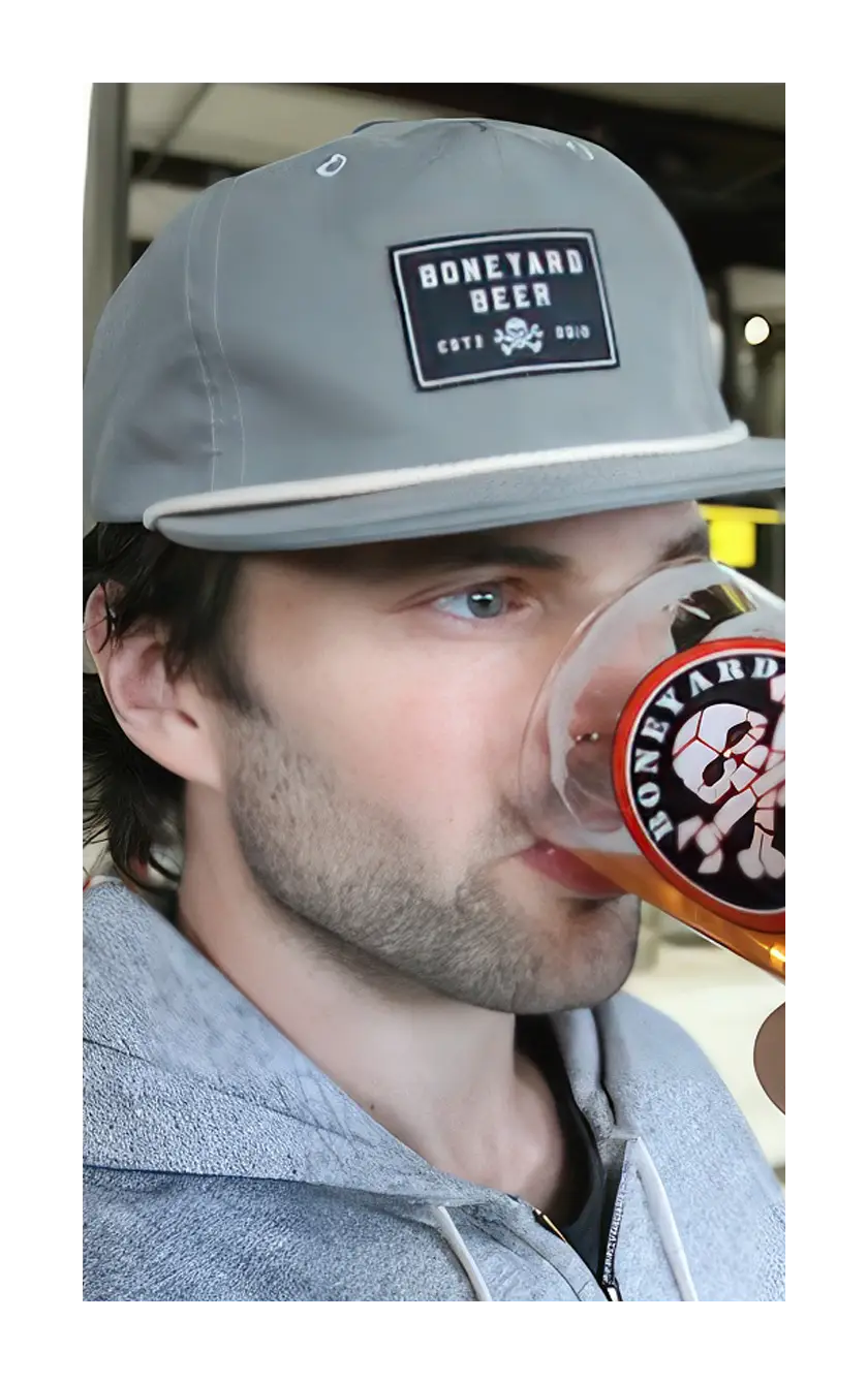 A photograph of a man wearing the black Boneyard grandpa hat.