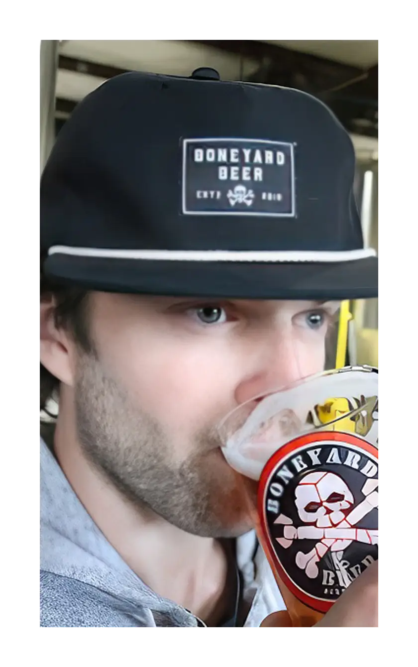 A photograph of a man wearing the black Boneyard grandpa hat.