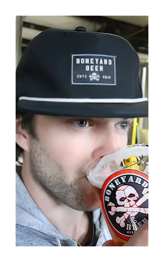 A photograph of a man wearing the black Boneyard grandpa hat.