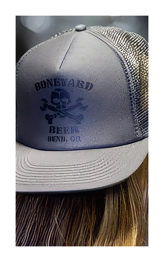 A photograph of the flat bill trucker hat.